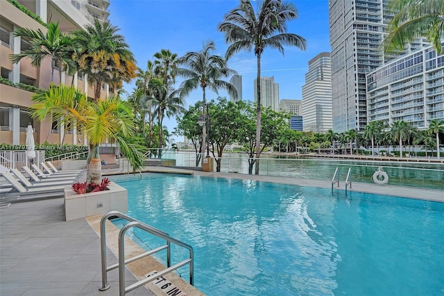 pool with a view of city and a patio