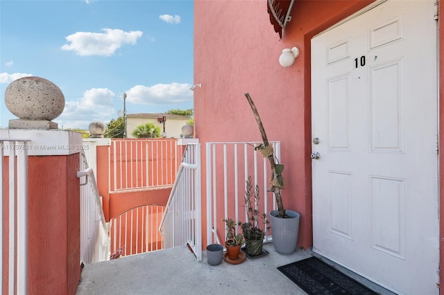 property entrance with stucco siding