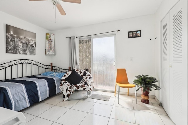 tiled bedroom with access to outside and a ceiling fan