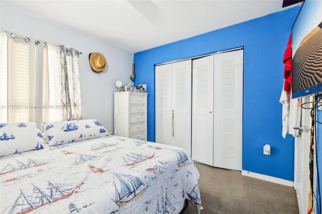 bedroom featuring carpet floors, a closet, and baseboards