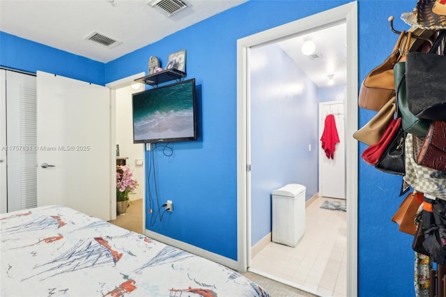 bedroom featuring visible vents and baseboards