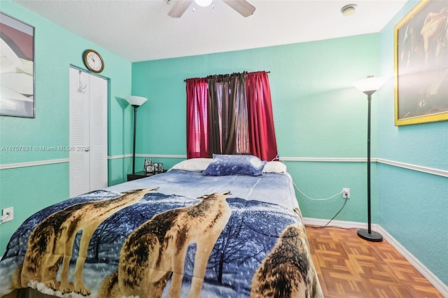 bedroom featuring a ceiling fan and baseboards