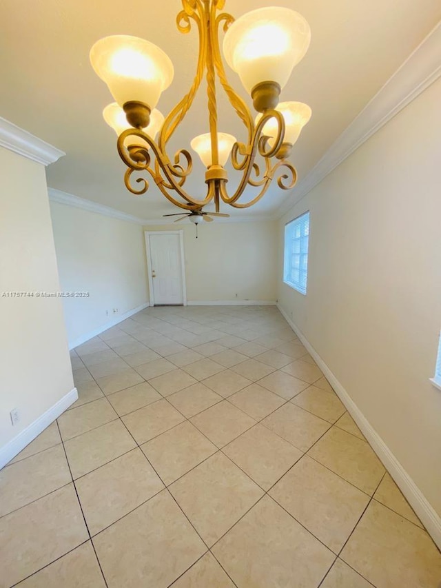 spare room with ornamental molding, a chandelier, baseboards, and light tile patterned floors