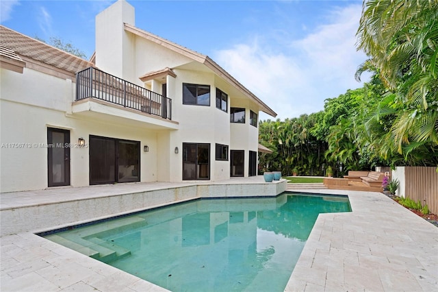 view of pool featuring fence, a fenced in pool, and a patio