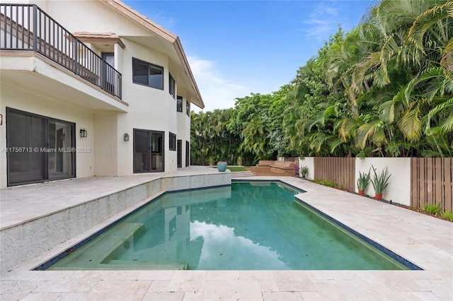 view of swimming pool with a fenced in pool, a patio area, and fence