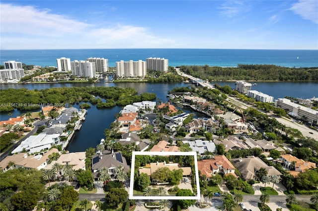 birds eye view of property featuring a water view