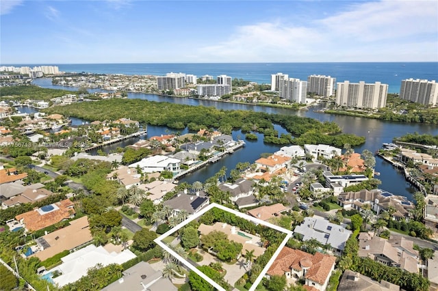 birds eye view of property with a water view