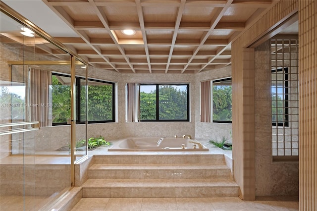 bathroom with coffered ceiling, a garden tub, and beamed ceiling