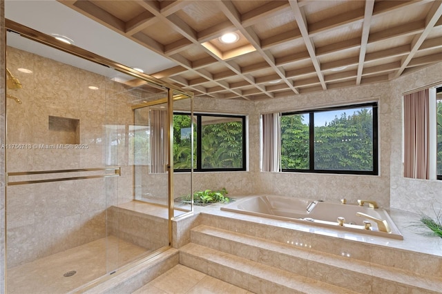 bathroom featuring a stall shower, coffered ceiling, a garden tub, and beam ceiling