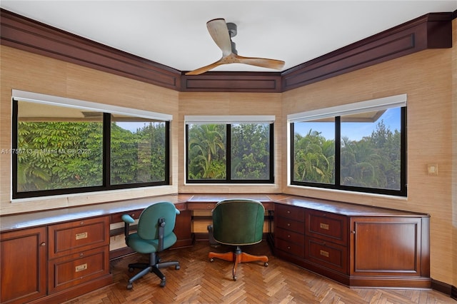 office area featuring a ceiling fan and built in desk