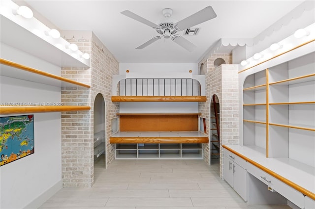 interior space featuring a ceiling fan and visible vents