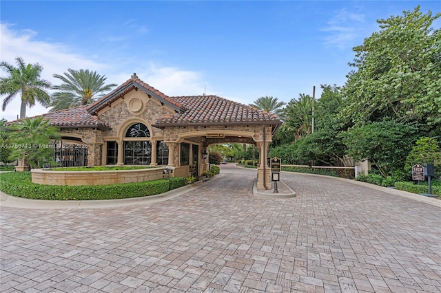 surrounding community with decorative driveway