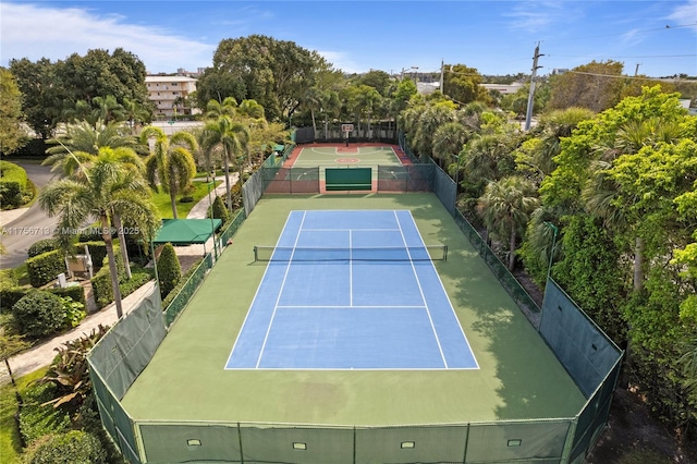 view of sport court featuring fence