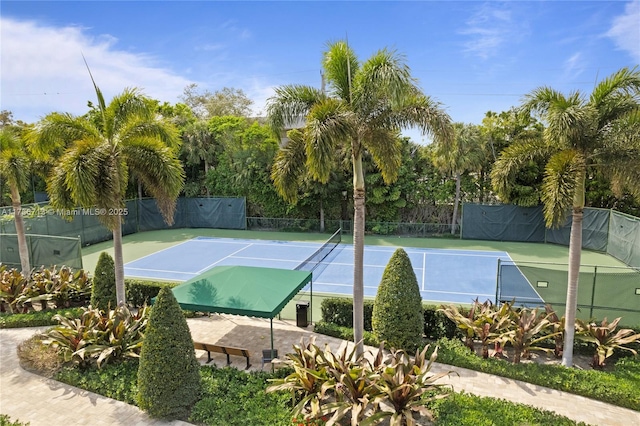 view of tennis court with fence