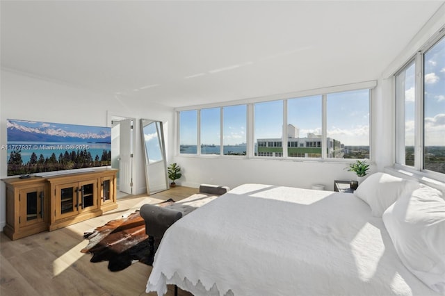 bedroom with light wood finished floors