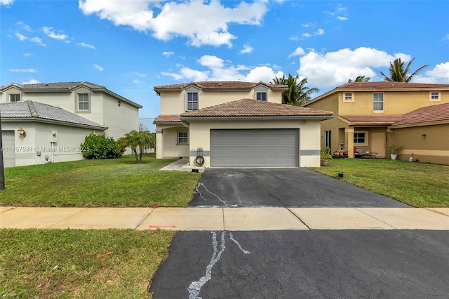 mediterranean / spanish home featuring a garage, stucco siding, aphalt driveway, and a front yard