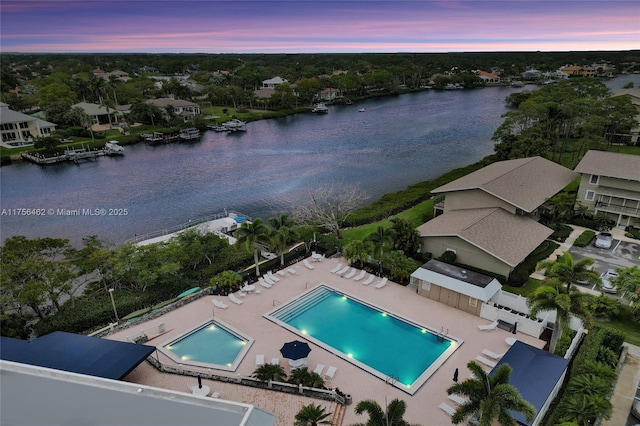 aerial view at dusk with a water view