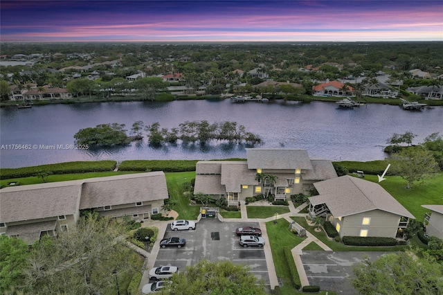 drone / aerial view with a water view and a residential view