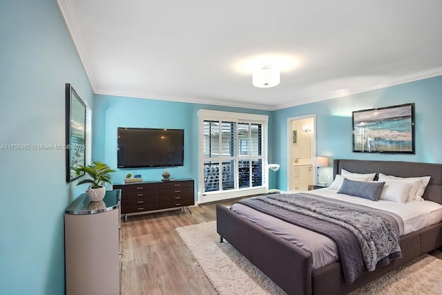 bedroom featuring crown molding and wood finished floors