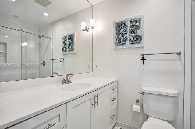 bathroom featuring recessed lighting, visible vents, toilet, a stall shower, and vanity