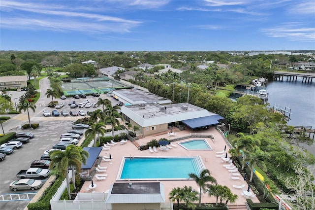 birds eye view of property with a water view