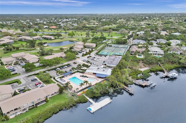 drone / aerial view featuring a residential view and a water view