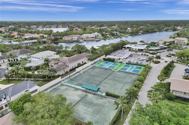 drone / aerial view with a residential view and a water view