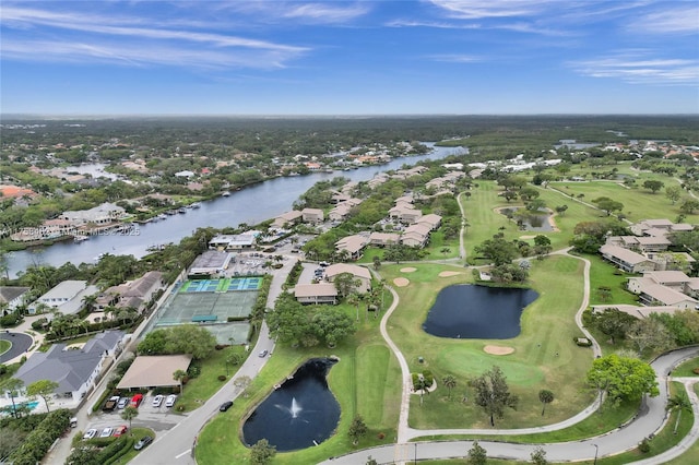 birds eye view of property featuring a residential view, view of golf course, and a water view