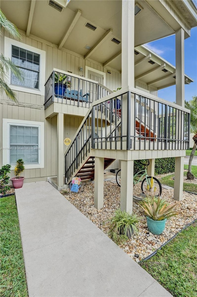 exterior space with stairs and visible vents