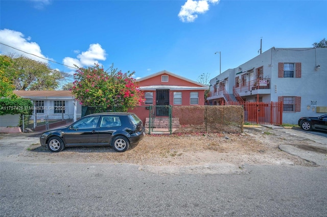 view of front of home featuring a fenced front yard and a gate