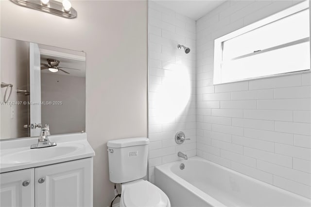 bathroom featuring toilet, shower / bathtub combination, ceiling fan, and vanity