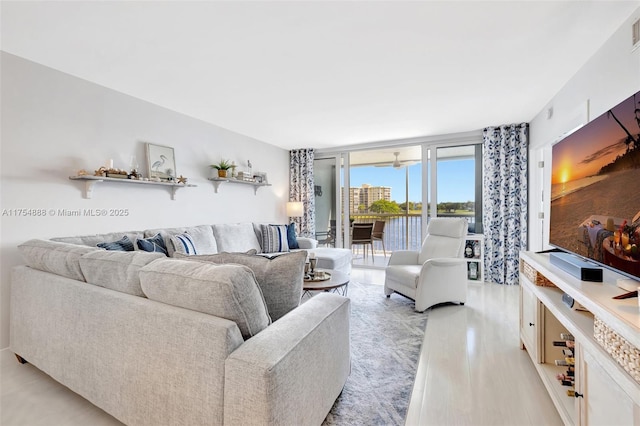 living room featuring expansive windows and visible vents