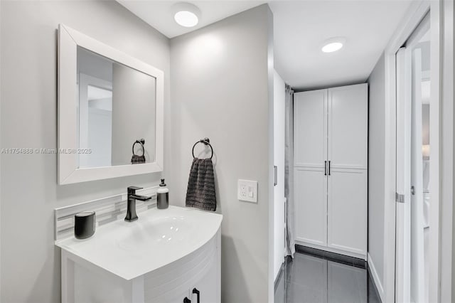 bathroom with tile patterned flooring and vanity