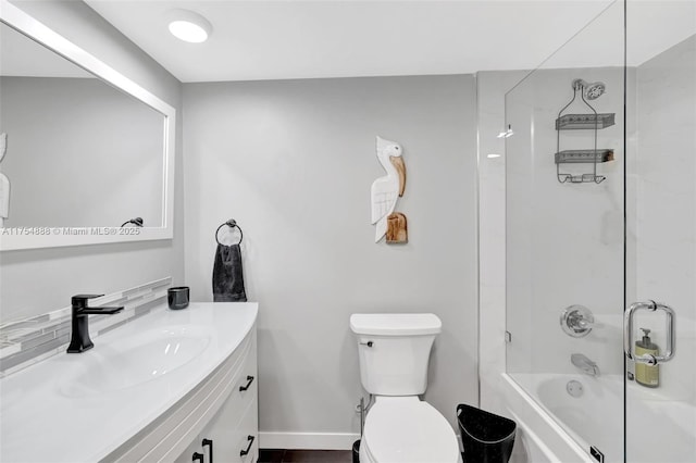 bathroom with shower / bath combination, baseboards, toilet, and vanity