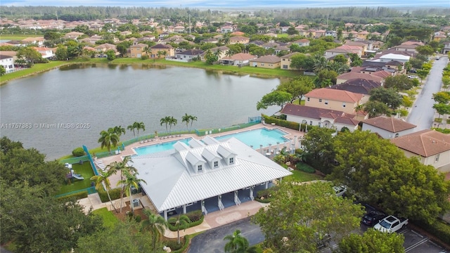 bird's eye view featuring a water view and a residential view