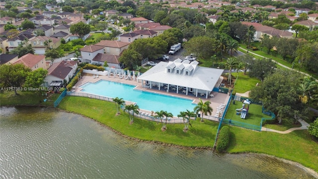 birds eye view of property with a water view and a residential view