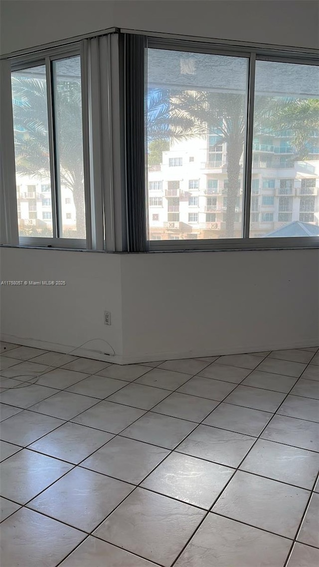 empty room featuring light tile patterned floors