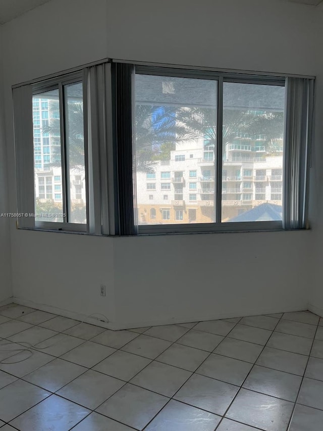 empty room with light tile patterned floors