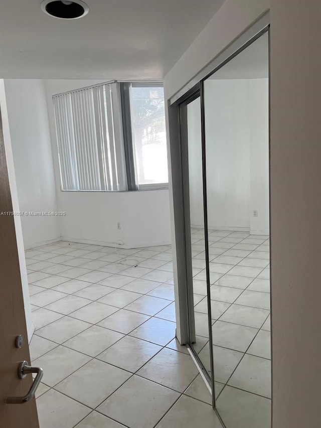 empty room with light tile patterned floors