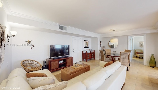 living room with light tile patterned flooring, crown molding, and visible vents