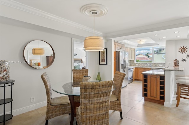 1236 Hillsboro Mile Unit 403, Hillsboro Beach, FL 33062 - dining area with crown molding, light tile patterned floors, a tray ceiling, baseboards, and recessed lighting
