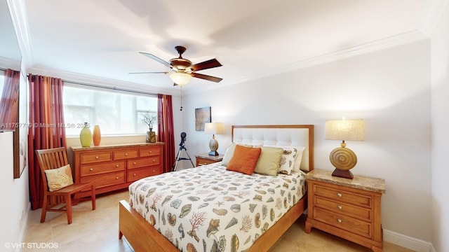 bedroom featuring baseboards, ornamental molding, and a ceiling fan