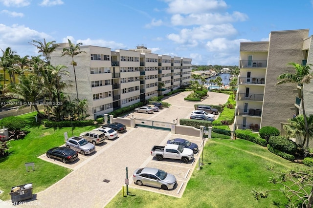 view of building exterior featuring uncovered parking