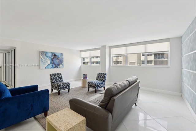 1236 Hillsboro Mile Unit 403, Hillsboro Beach, FL 33062 - living room featuring baseboards and light tile patterned floors