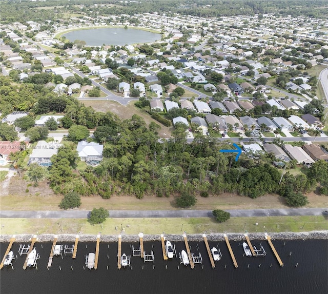 bird's eye view with a water view and a residential view