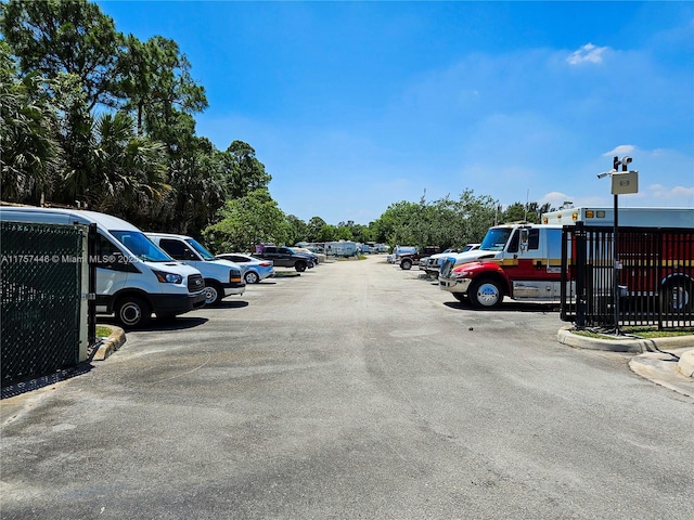 uncovered parking lot with fence