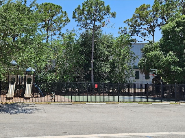 view of gate featuring fence