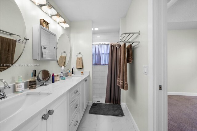 8904 SW Fishermans Wharf Dr, Stuart, FL 34997 - bathroom with tiled shower, double vanity, and baseboards