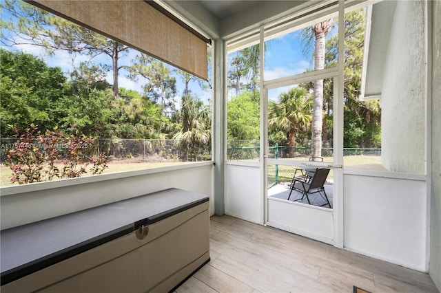 8904 SW Fishermans Wharf Dr, Stuart, FL 34997 - sunroom / solarium with wood finished floors, plenty of natural light, and view of scattered trees