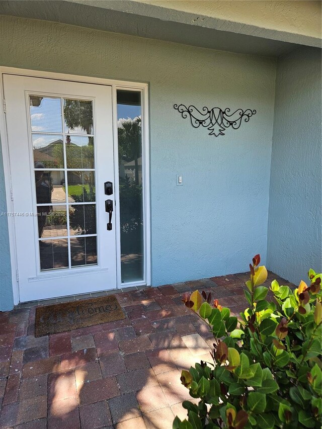 8904 SW Fishermans Wharf Dr, Stuart, FL 34997 - entrance to property with stucco siding